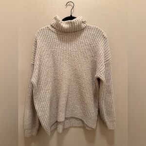 cream colored turtleneck sweater